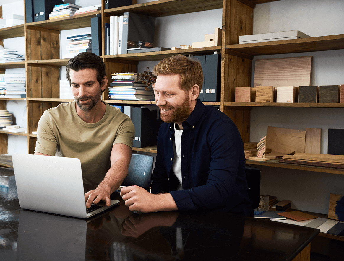 Two men working on a computer